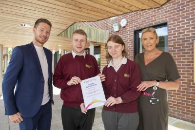Celebrating gaining Autism Accreditation at Advanced from the National Autistic Society are, left to right, Councillor Christopher Burden, Cabinet Member for Education, Skills and Work, Tettenhall Wood School students Thomas Watkins and Alyssa Dunn, and Sarah Whittington, Executive Headteacher