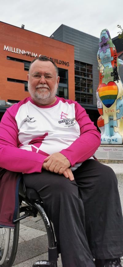 Dr Paul Darke in front of the 2017 Wolves in Wolves Sculpture in the University of Wolverhampton’s Quad, City Centre Campus. The sculpture was commissioned by Dr Darke from the artist Alex Vann to promote and further suicide prevention work by Wolverhampton Suicide Prevention Stakeholders Forum in 2017. (Photo credit: MC Darke)
