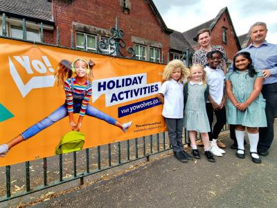 From (l-r), Councillor Chris Burden, Cabinet Member for Education, Skills and Work, Philip Salisbury, Headteacher at Woodfield Primary School in Penn, and pupils celebrate the launch of this year’s Yo! Summer activity programme