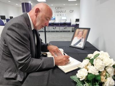Pictured signing the Book of Condolence at the Civic Centre this morning is Chief Executive of the City of Wolverhampton Council, Tim Johnson