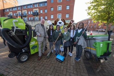 Councillor Steve Evans, cabinet member for city environment and climate change with Rex Reuse and Year 5 pupils from Woodfield Primary School, Mahi, Fechi, Prabhjot, Tayla-Rose, and Sadeem
