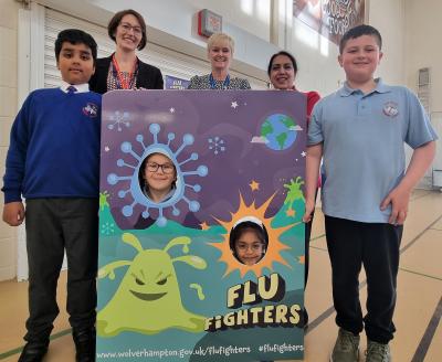 Pupils at Rakegate Primary School have become Flu Fighters after having their free flu vaccination in school last week. They are joined by the City of Wolverhampton Council's Health Improvement Officer Caroline Brand, school Headteacher Sarah Horton, and Councillor Jasbir Jaspal, Cabinet Member for Public Health and Wellbeing