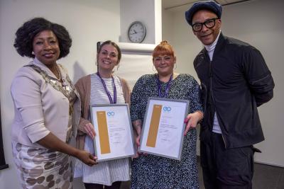 Hannah Hill and Hannah Finch receive the Education Otherwise KIT Gold Award for excellence from the Mayor of Wolverhampton Councillor Sandra Samuels OBE and Jay Blades MBE