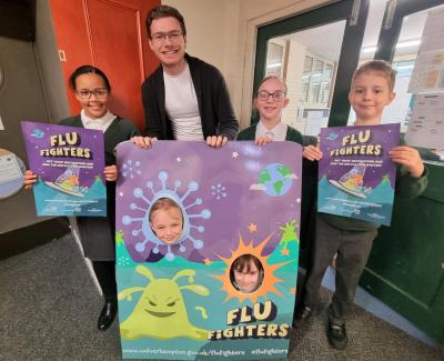 Councillor Chris Burden, Cabinet Member for Education, Skills and Work, with pupils from Woodfield Primary School who are receiving their flu vaccinations