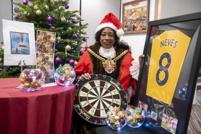 The Mayor of Wolverhampton Councillor Sandra Samuels OBE with the charity auction lots