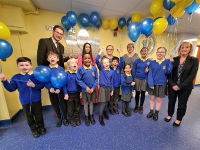 Councillor Chris Burden, Cabinet Member for Education and Skills, joins Deputy Headteacher Kully Kaur, Headteacher Julie Mills, Deputy Headteacher Ange Coles and pupils to celebrate Manor Primary School’s Outstanding Ofsted result with Anita Cliff, CEO at Manor Multi Academy Trust (right)