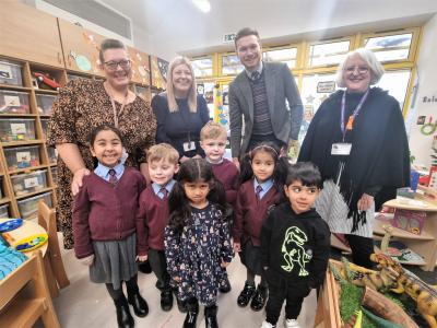 Back row, left to right, Early Years Foundation Stage Lead Practitioner Laura Benbow, Headteacher Rachel Kilmister, Cabinet Member for Education, Skills and Work Councillor Chris Burden and Brenda Wile, the City of Wolverhampton Council's Deputy Director of Education, celebrate the opening of new classrooms with pupils at St Bartholomew’s CE Primary School