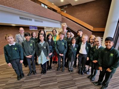 Naomi Roberts, Assistant Headteacher, Councillor Jasbir Jaspal, Cabinet Member for Public Health and Wellbeing, Councillor Beverley Momenabadi, Cabinet Member for Children and Young People, and pupils from Uplands Junior School who are preparing to mark Children's Mental Health Week