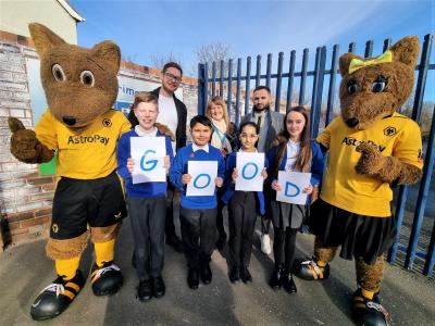 Eastfield Primary School pupils celebrate their Good Ofsted rating with Councillor Chris Burden, the City of Wolverhampton Council’s Cabinet Member for Education, Skills and Work, Sarah Hay, Headteacher, Tom Warren, Chair of Governors, and Wolverhampton Wanderers mascots Wolfie and Wendy