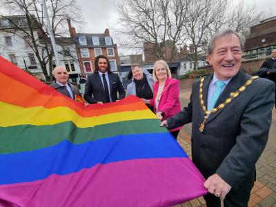 L-R: Sean Aldis, Chief Executive at Wolverhampton Homes; Adam Vasco, Director of Diversity & Inclusion in Professional Practice at University of Wolverhampton; Bethany Coey-Archer, Chair of the Rainbow Staff Equality Forum at City of Wolverhampton Council; Deputy Mayoress of Wolverhampton, Lynn Plant and the Deputy Mayor of Wolverhampton, Councillor Dr Michael Hardacre raise the rainbow flag in St Peter’s Square to mark the start of LGBT History Month