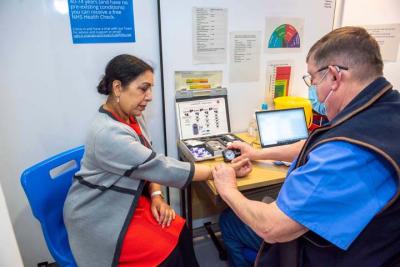 Councillor Jasbir Jaspal, the City of Wolverhampton Council’s Cabinet Member for Public Health and Wellbeing, has a free health check with Andy York, Healthcare Paramedic, at the Mander Centre Health Hub
