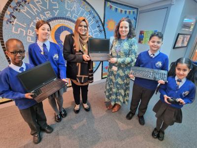 Pictured is Councillor Ahmed donating devices from Wolves Tech Aid to headteacher Vicky Minihane and pupils from St Mary’s Catholic Primary Academy