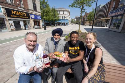 (L-R): Rob Miles of Hearts Distillery, Councillor Bhupinder Gakhal, Wolverhampton Council Cabinet Member for Visitor City, Nico Chitsa of Nimo’s, and Lara Davis, LSD Promotions Events Manager, sat in new-look Victoria Street where they will be involved in the Food, Drink & Artisan Market