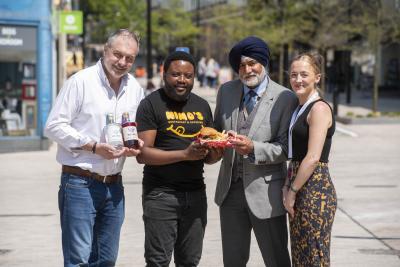 L-R): Rob Miles of Hearts Distillery, Nico Chitsa of Nimo’s, Councillor Bhupinder Gakhal, Wolverhampton Council Cabinet Member for Visitor City, and Lara Davis, LSD Promotions Events Manager, stood in new-look Victoria Street where they will be involved in the Food, Drink & Artisan Market