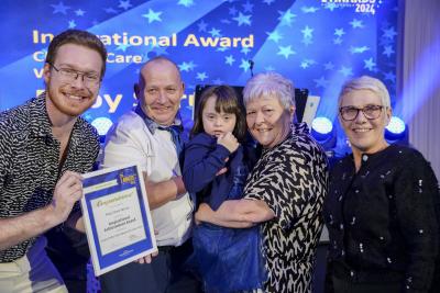 City of Wolverhampton Council Director of Children’s Services, Alison Hinds, and Cllr Chris Burden present Ruby Spruce, accompanied by her grandmother Doreen and Grandfather Steven, with Inspirational Child in Care of the Year award