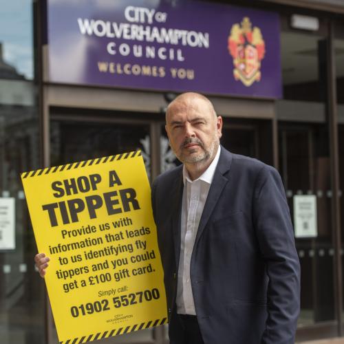 Councillor Craig Collingswood, cabinet member for environment and climate change at City of Wolverhampton Council, with details of the Shop a Tipper scheme