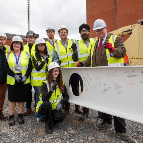 (L-R): City Learning Quarter partners and students come together to sign the first steels for the new city centre campus – Alex Omelchuk, Turner & Townsend Project Manager, Anna Place, Adult Education Wolverhampton Deputy Head of Service, David Byrne, McLaughlin & Harvey Ltd Operations Manager, City of Wolverhampton College students Ellaika Antonius, Level 3 IT, aged 19, and Doina Surchicin, Level 1 IT, 16, Cllr Chris Burden, City of Wolverhampton Council Cabinet Member for City Development, Jobs and Skills, Peter Merry, City of Wolverhampton College Deputy Chief Executive,  Ninder Johal DL, Wolverhampton City Investment Board Chair, Cllr Stephen Simkins, City of Wolverhampton Council Leader
